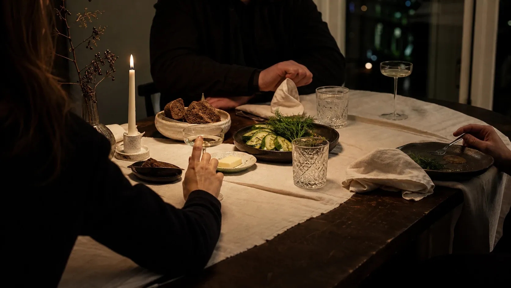 A contemporary Latvian private table with rye bread, cucumber and dill