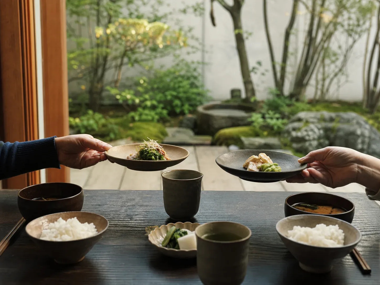 A calm dinner for two beside a small Japanese garden