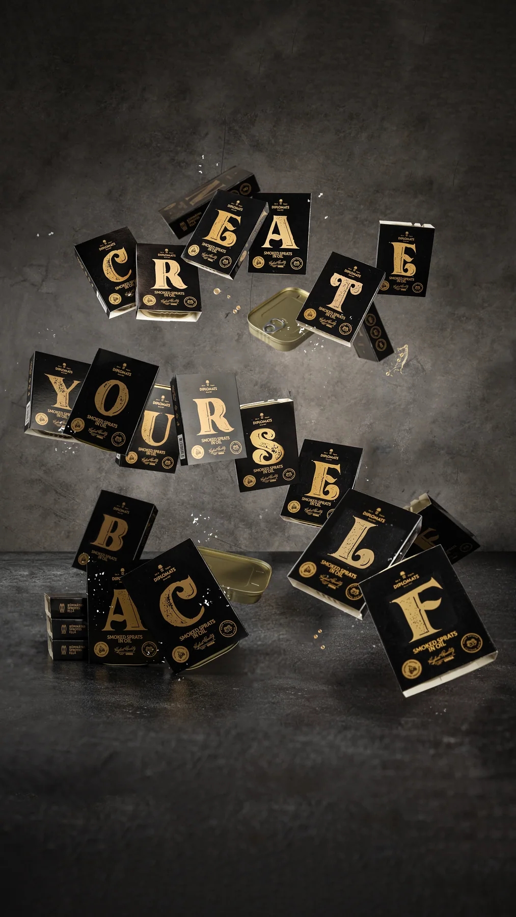 Diplomats Alphabet product packs arranged as a typographic composition