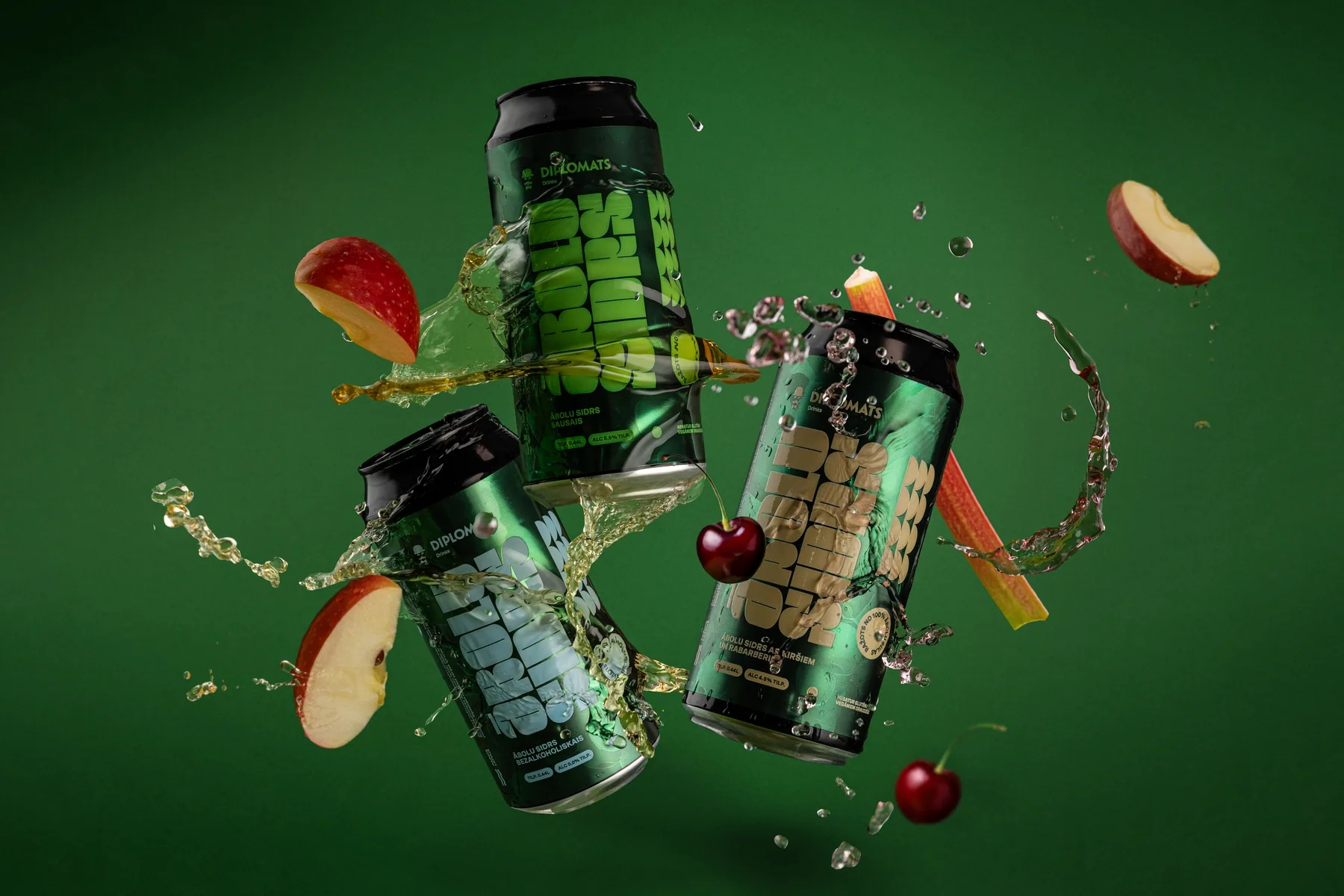 Diplomats drinks with apple, carrot and cherry ingredients against a green background