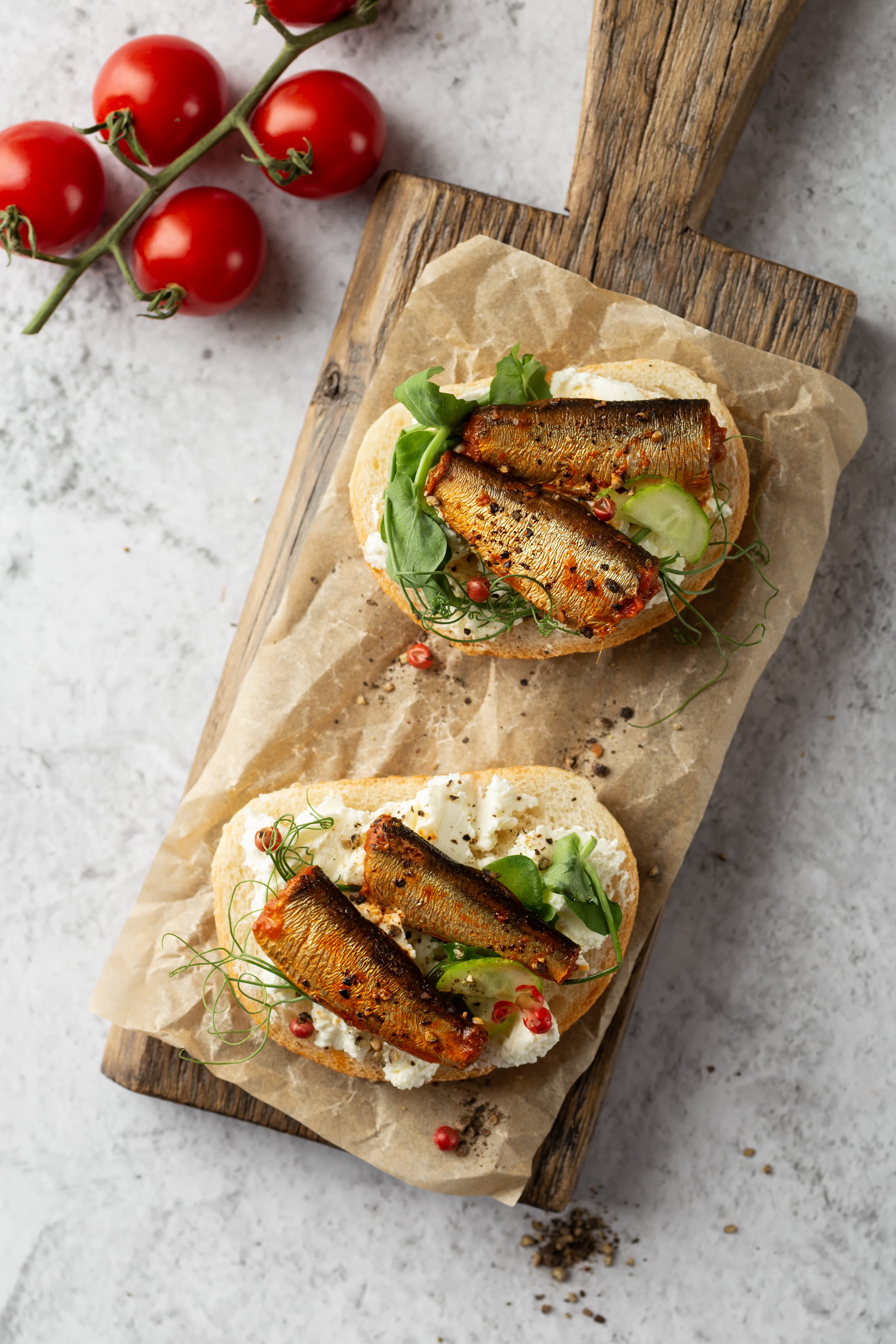 Diplomats Classics smoked sprats served on open sandwiches