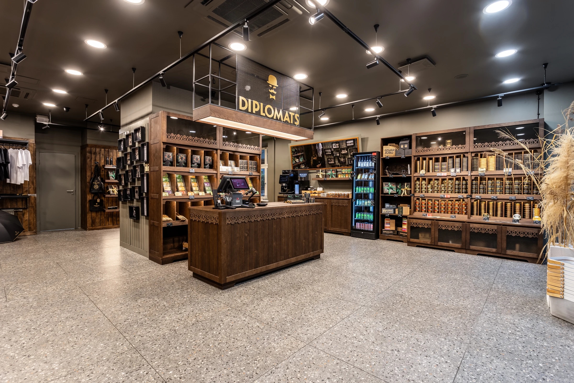 Wide view of the Diplomats Riga store interior and branded product displays