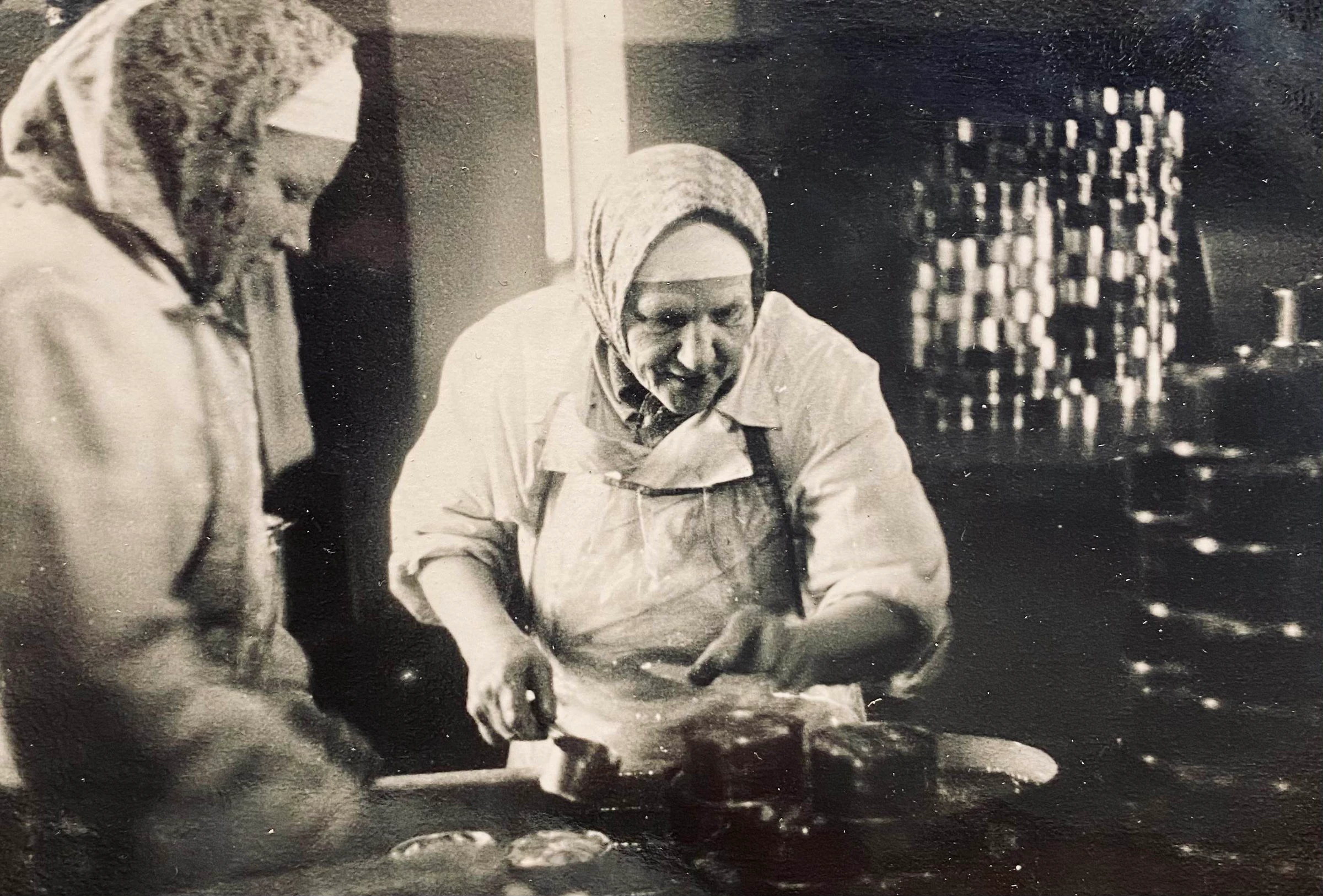 Engure production specialists working by hand in an archival photograph