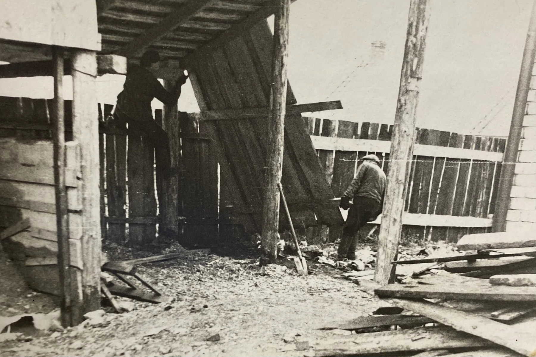 Workers repairing a timber structure at the historic Engure production site